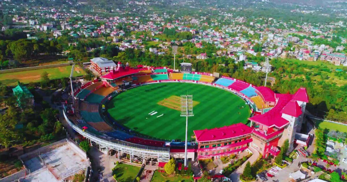 The breathtaking Dharamshala Cricket Stadium with the majestic Dhauladhar mountains in the backdrop — where world-class cricket meets Himalayan serenity.