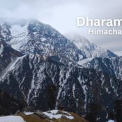 Breathtaking view of Dharamshala nestled in the lap of the Dhauladhar mountains, where nature meets serenity.