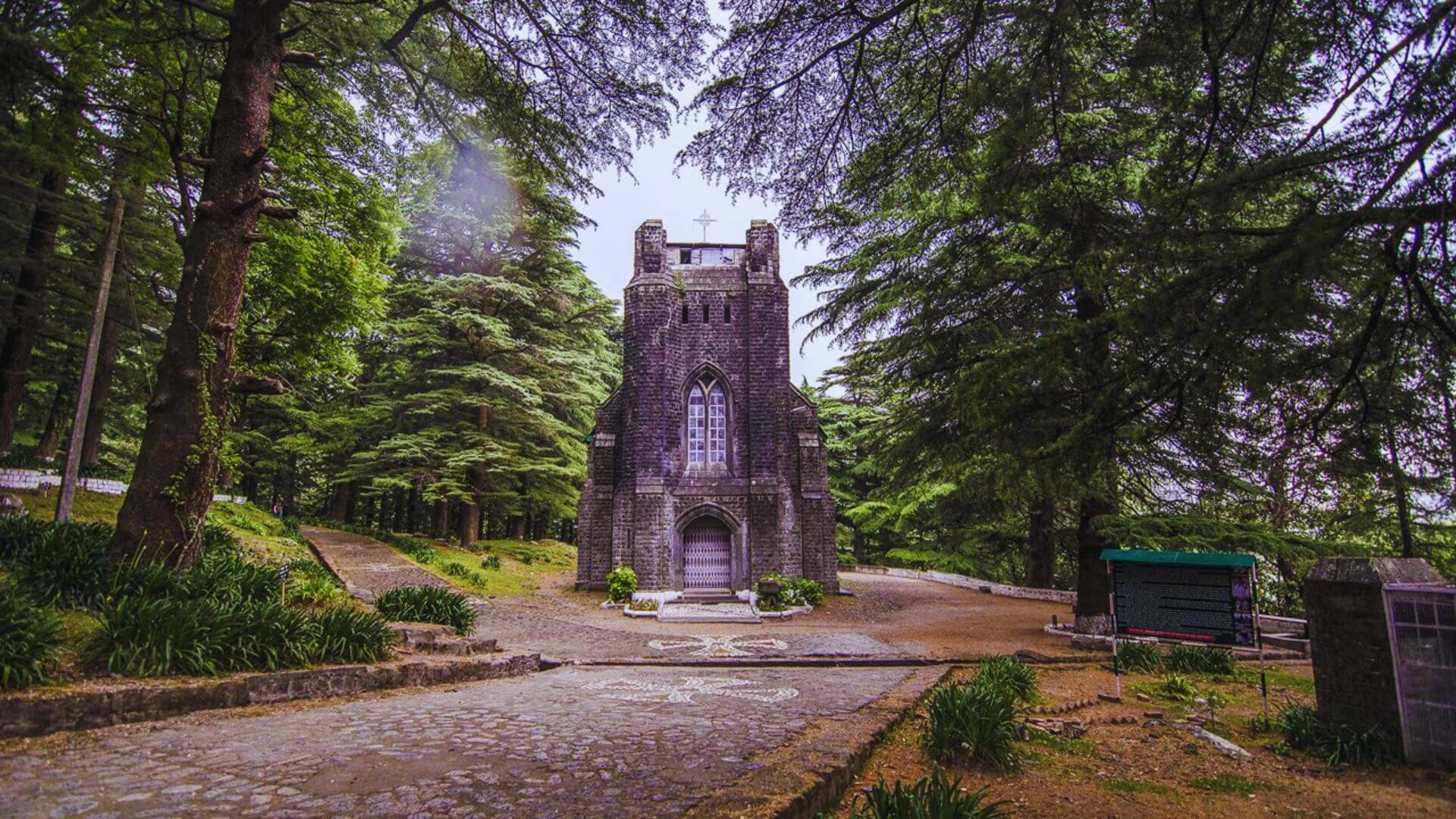 St. John in the Wilderness Church, Dharamshala – a serene 19th-century Gothic church set amidst towering deodar trees and rich colonial heritage.